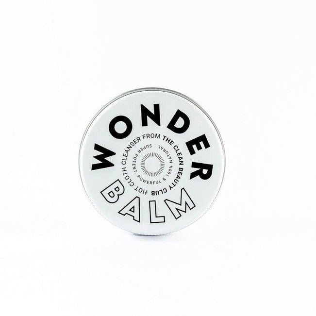 Round white balm container with 'Wonder Balm' text on a white background